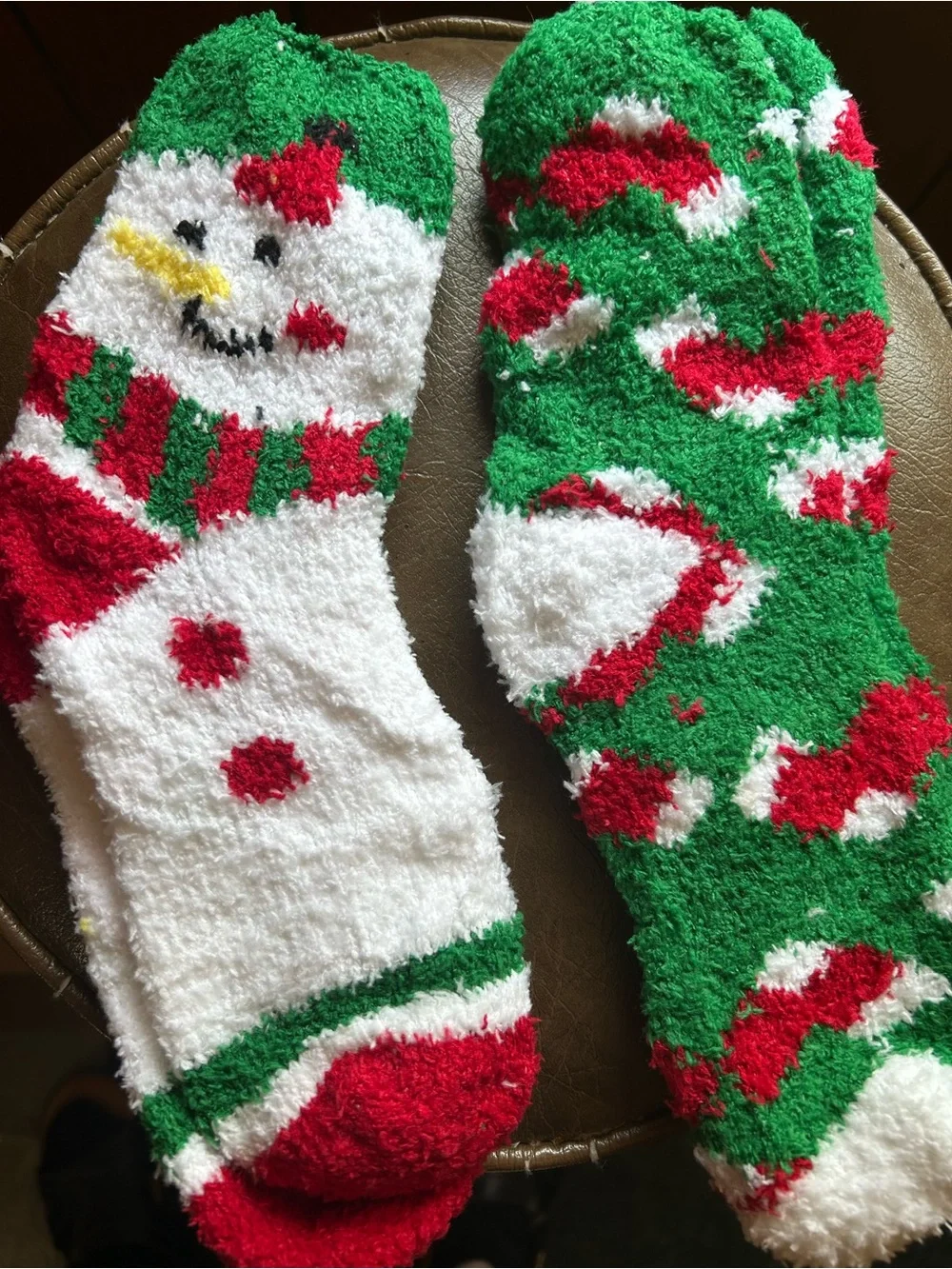 16oz Snowman Cup, 2 pairs of Fuzzy Socks, 2 Lip Balms and Christmas Ornament
